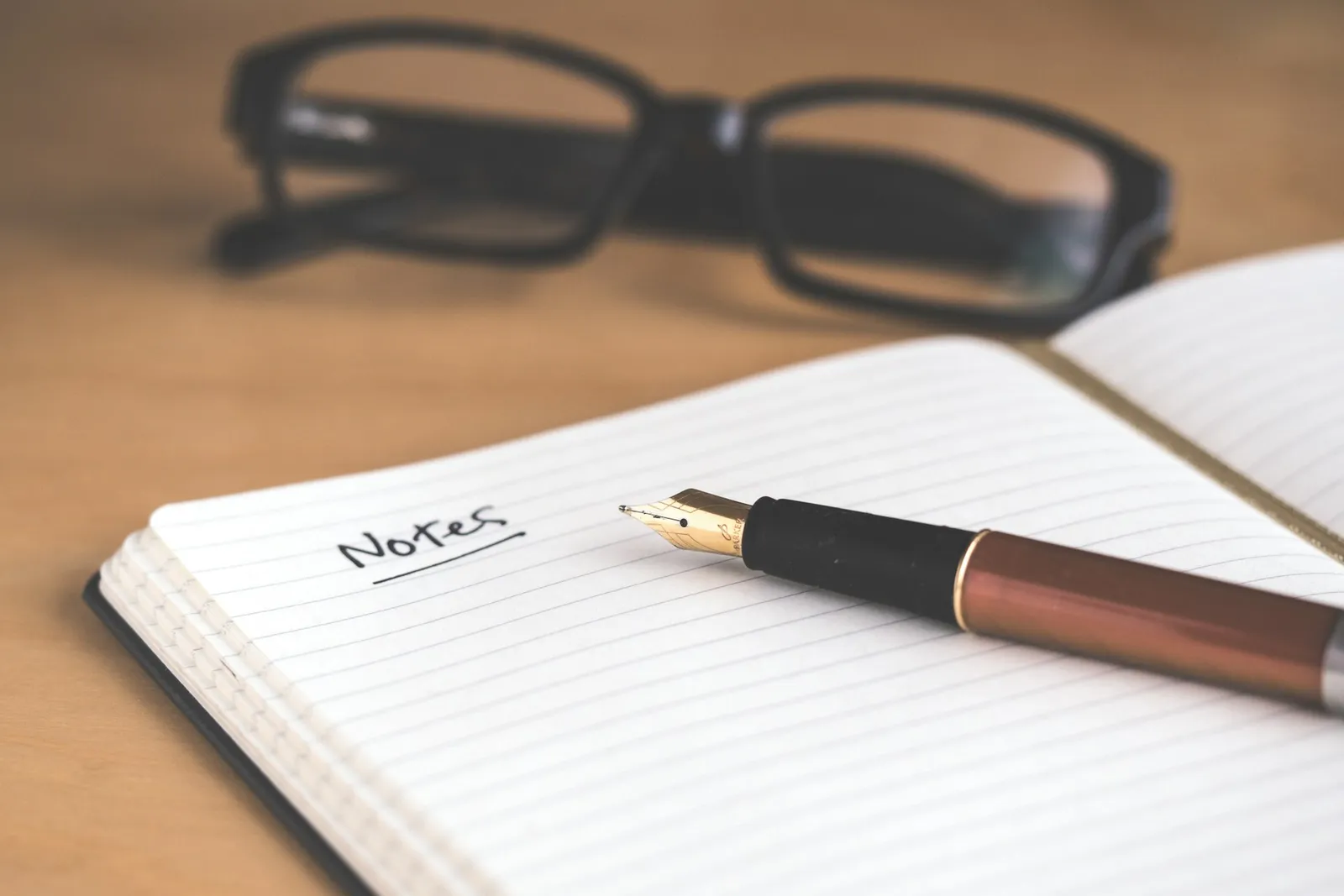 Premium diary and fountain pen on a desk